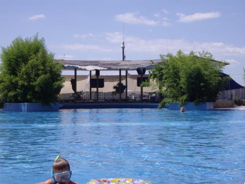a person in the water in a swimming pool at STUDIO DELUXE IN MARINA CAPE 4 stars complex 33 7 in Aheloy