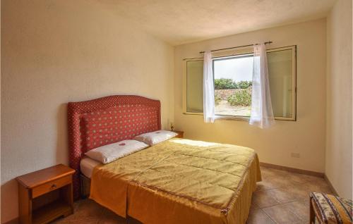 a small bedroom with a bed and a window at Awesome Apartment In La Ciaccia With 1 Bedrooms in Codaruina