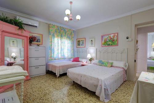 Postel nebo postele na pokoji v ubytování Casa Rural Los Rosales en el Corazon de la Mancha