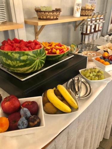 a buffet with fruits and vegetables on a table at Hotel President in Cervia