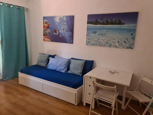 a small room with a bed and a desk at Sunshine Apartment in Rome