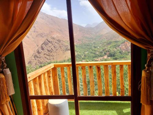 a view of a mountain from a window at Atlas Prestige in Imlil
