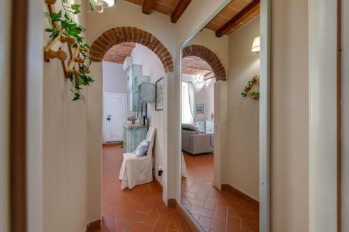 a hallway with an archway in a house at eLLe Apartments Firenze in Florence