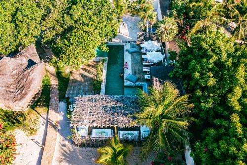 an overhead view of a resort with palm trees at La Cozinha Bungalow in Barra Grande