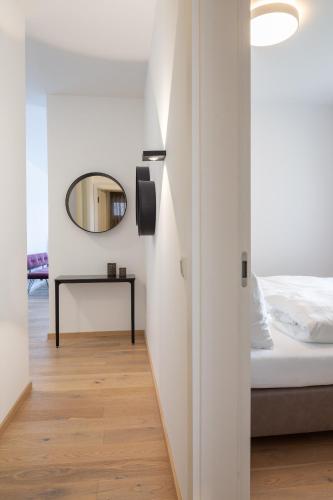 Postel nebo postele na pokoji v ubytování Hermitage Apartments