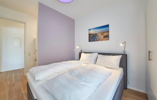 Postel nebo postele na pokoji v ubytování Hermitage Apartments