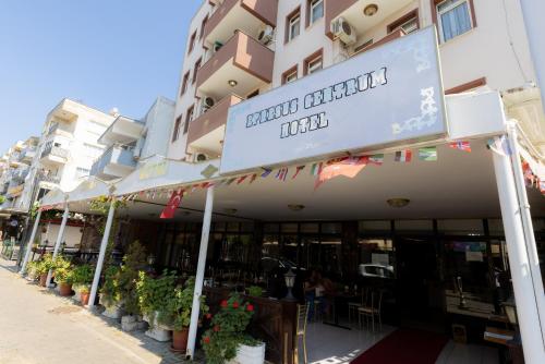 a restaurant with a sign on the side of a building at EPHESUS CENTRUM in Selcuk