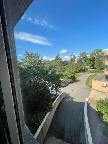 a view of a street from a window at Les Logis de Paray Appartement 202 in Paray-le-Monial