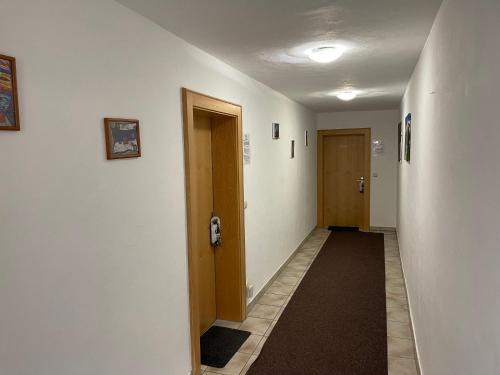 a hallway with two elevators and a hallway with two doors at Haus Monika in Kirchberg in Tirol
