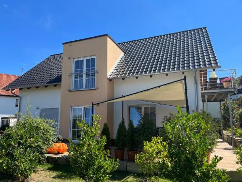 a white house with a roof at Villa Florentine in Bad Liebenstein