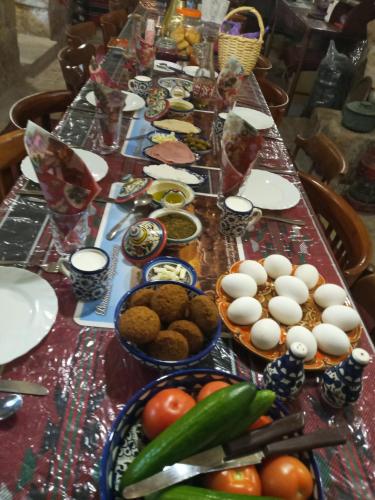 a long table with many plates and bowls of food at BREAD HOUSE in Bethlehem