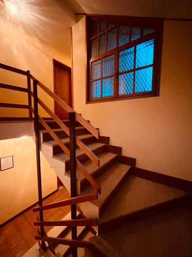 a staircase in a building with a window at La Baita Limone Riserva Bianca Ski-in Ski-out Seggiovia Morel 1 in Limone Piemonte