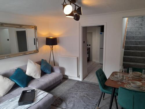 a living room with a couch and a table at 93 Newtown Road in Great Malvern