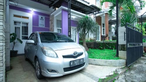 a small car parked in front of a house at Villa Casa Liana by Masterpiece Villa in Tlekung