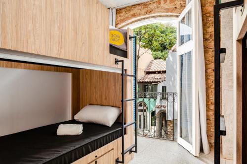 a tiny house with a window and a bench at JO&JOE Rio de Janeiro Largo do Boticario in Rio de Janeiro