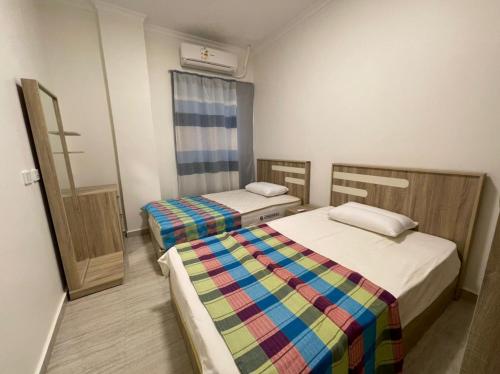 Llit o llits en una habitació de Dahab Residence