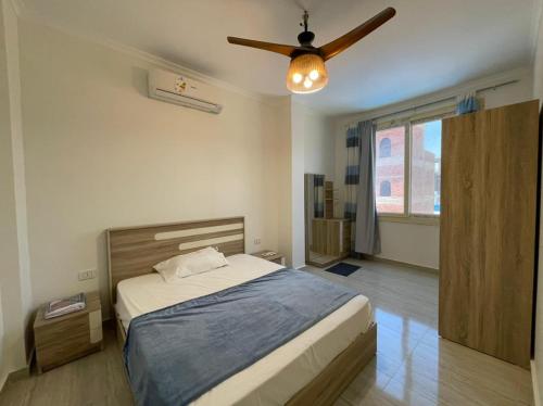 מיטה או מיטות בחדר ב-Dahab Residence