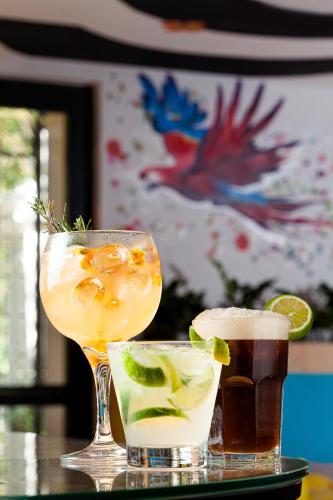 two cocktails sitting on a table with a drink at JO&JOE Rio de Janeiro Largo do Boticario in Rio de Janeiro