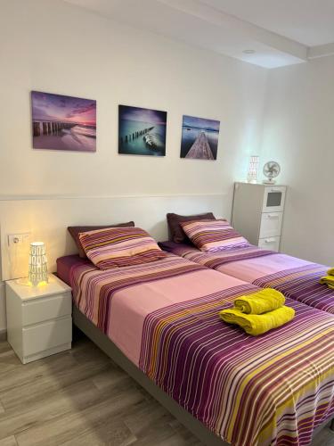 two beds sitting next to each other in a bedroom at LOS ANGELES APARTMENT Los Cristianos in Los Cristianos