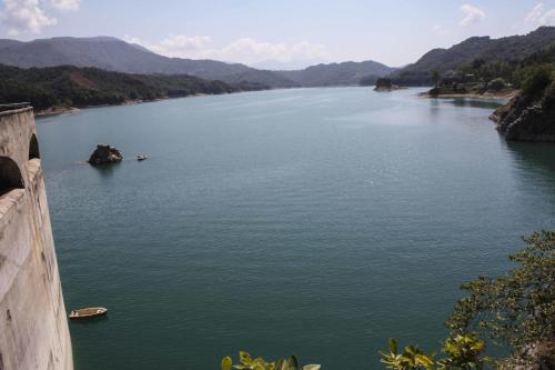a view of a river with mountains in the background at Casa Vacanze Antico Poggio in Poggio San Giovanni