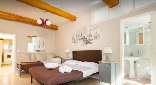 A bed or beds in a room at Perugia Historic Center Apartment