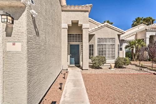a white brick house with a driveway in front of it at New Home Hot Tub, Grill, Games, 11 Mi to Strip! in Las Vegas