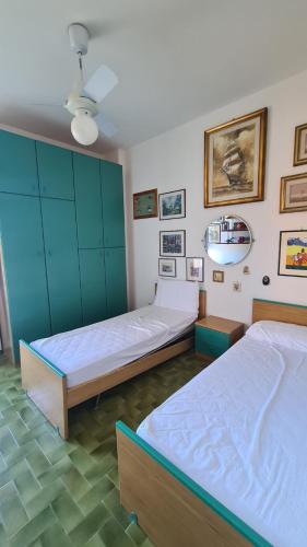 Posteľ alebo postele v izbe v ubytovaní Appartamento Sole Mare