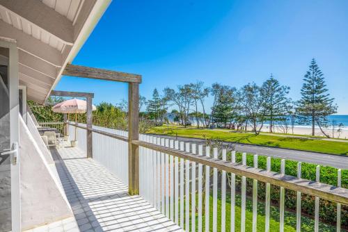 a balcony with a view of the beach at Barbara by Kinsfolk in Byron Bay