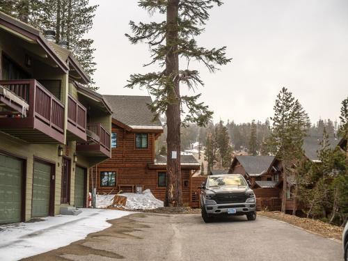 a truck parked in a driveway in front of a house at COZY Condo at Canyon Lodge! Sleeps 8, a walk to Canyon Lodge in Mammoth Lakes
