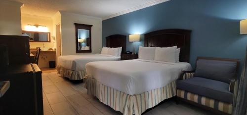 Кровать или кровати в номере Fort Lauderdale Grand Hotel