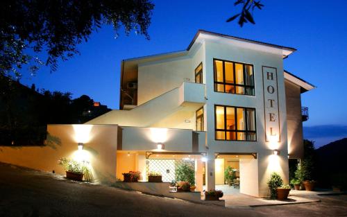 a white house with lights on it at night at Valle Del Buttero in Capalbio