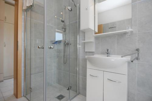 a bathroom with a shower and a sink at Apartment Pinezici 5464d in Pinezici