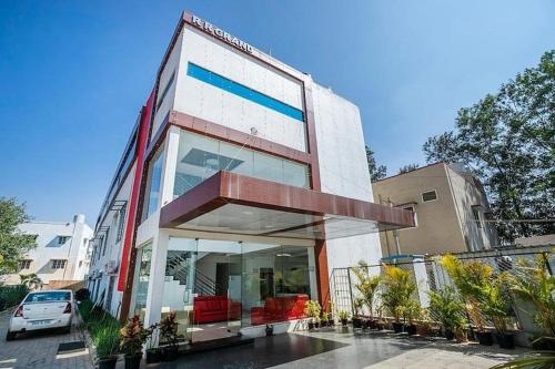 a large building with glass windows on a street at SQUARE INN in Bengaluru