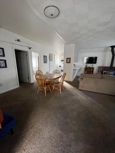 a living room with a table and chairs and a couch at June Lake Villager in June Lake