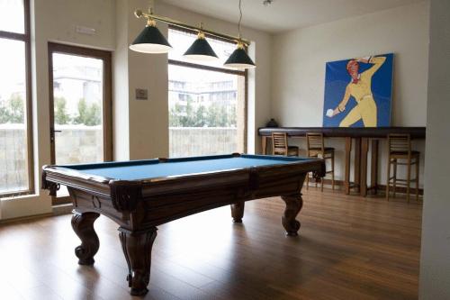 a living room with a pool table in it at White Lavina - Ski, Bike, Hike in Bansko