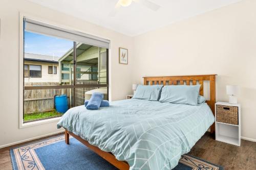 a bedroom with a bed and a large window at Panoscape in Sunset Strip