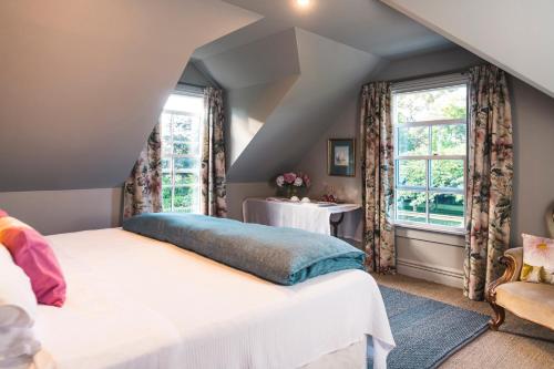 a bedroom with two beds and a window at Ranginui Retreat in Masterton