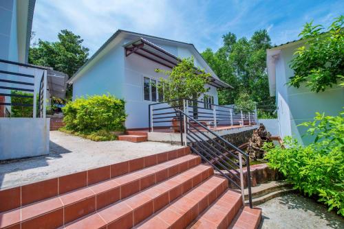 a set of stairs leading to a house at Ngoc Hanh Bungalow Phu Quoc in Phu Quoc