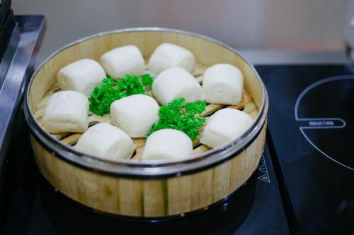 a bucket of marshmallows with parsley in it at Pariat River Front Hotel in Da Nang