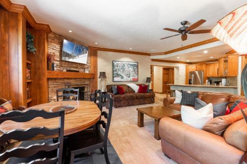 a living room with a couch and a table at Strawberry Park Ski-in Ski-Out Condo Close to Chairlift in Beaver Creek