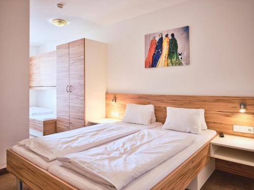 Кровать или кровати в номере Grafenberg Resort by Alpeffect Hotels