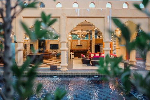 a view of the lobby of a building with a swimming pool at The Air Khaoyai Hotel SHA Extra Plus in Mu Si