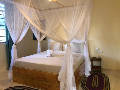 Cama o camas de una habitación en Zanzibar Tropical Sunset Boutique Hotel