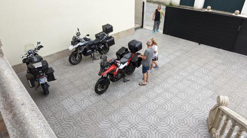 a group of motorcycles parked in a room at Room Villa Ribeiro pilgrims way to SANTIAGO bike a garage for Marinhas Esposende in Esposende