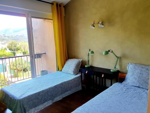 Ένα ή περισσότερα κρεβάτια σε δωμάτιο στο Villa Roquebrune Cosy