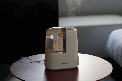 a cell phone sitting on top of a table at remm Kagoshima in Kagoshima