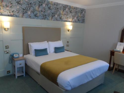 Ένα ή περισσότερα κρεβάτια σε δωμάτιο στο Stanton House Hotel