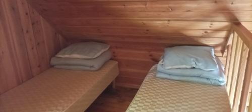 Postel nebo postele na pokoji v ubytování Kempings Sniedzes