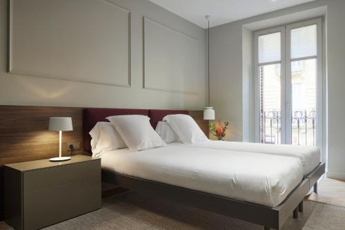 Кровать или кровати в номере Azoka Suite by FeelFree Rentals