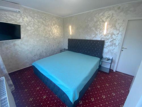 Postel nebo postele na pokoji v ubytování Vila Ammos Mamaia Sea View